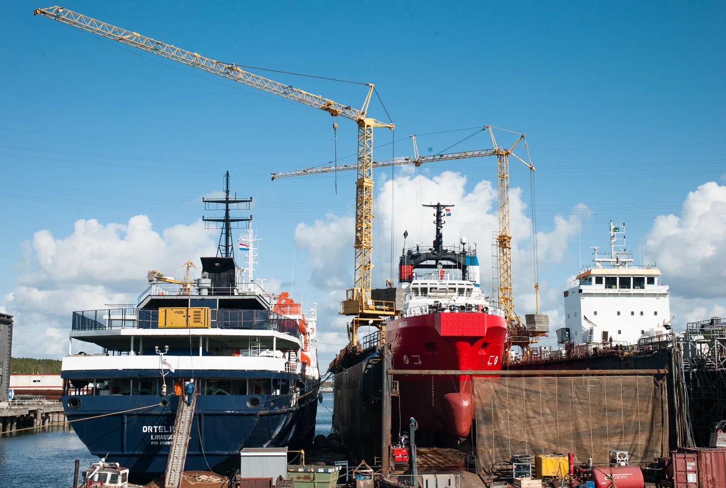 Ships and cranes at a shipyard.
